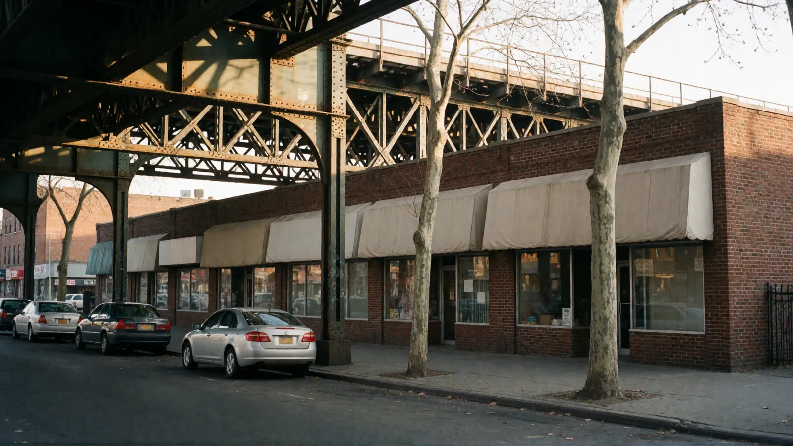 A Queens commercial street under the elevated 7 train line near Woodside